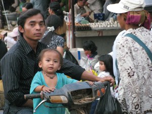 Dad & son on the bike at the Battambang market